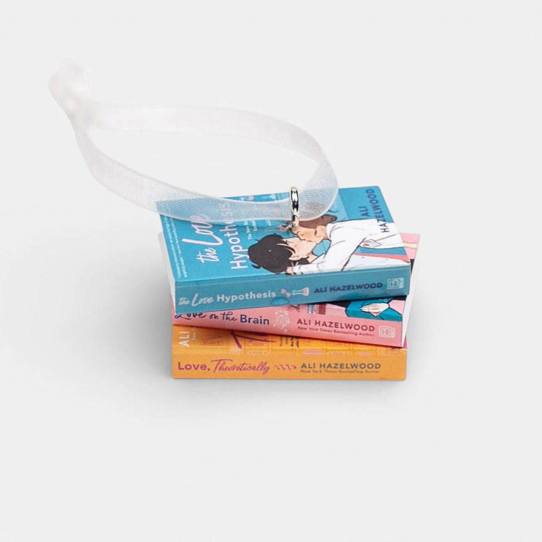 Ornament featuring a stack of Ali Hazelwood books on a white background