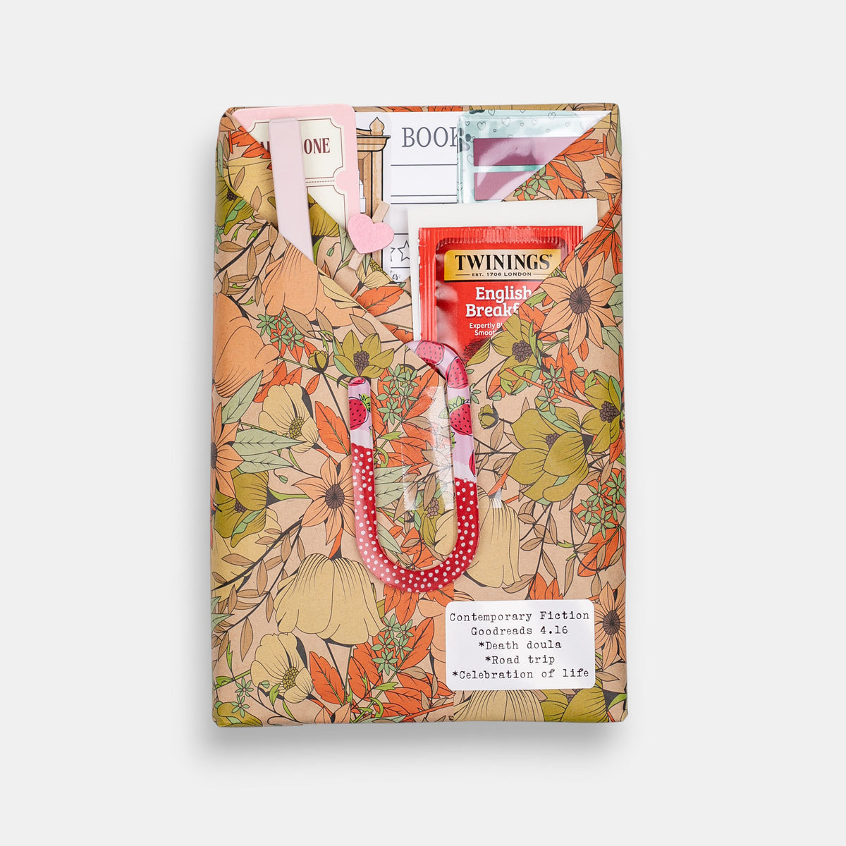 Blind Date with a Book by The Salty Cat Co, a multicoloured floral reading accessory bundle with tea packet and jumbo paper