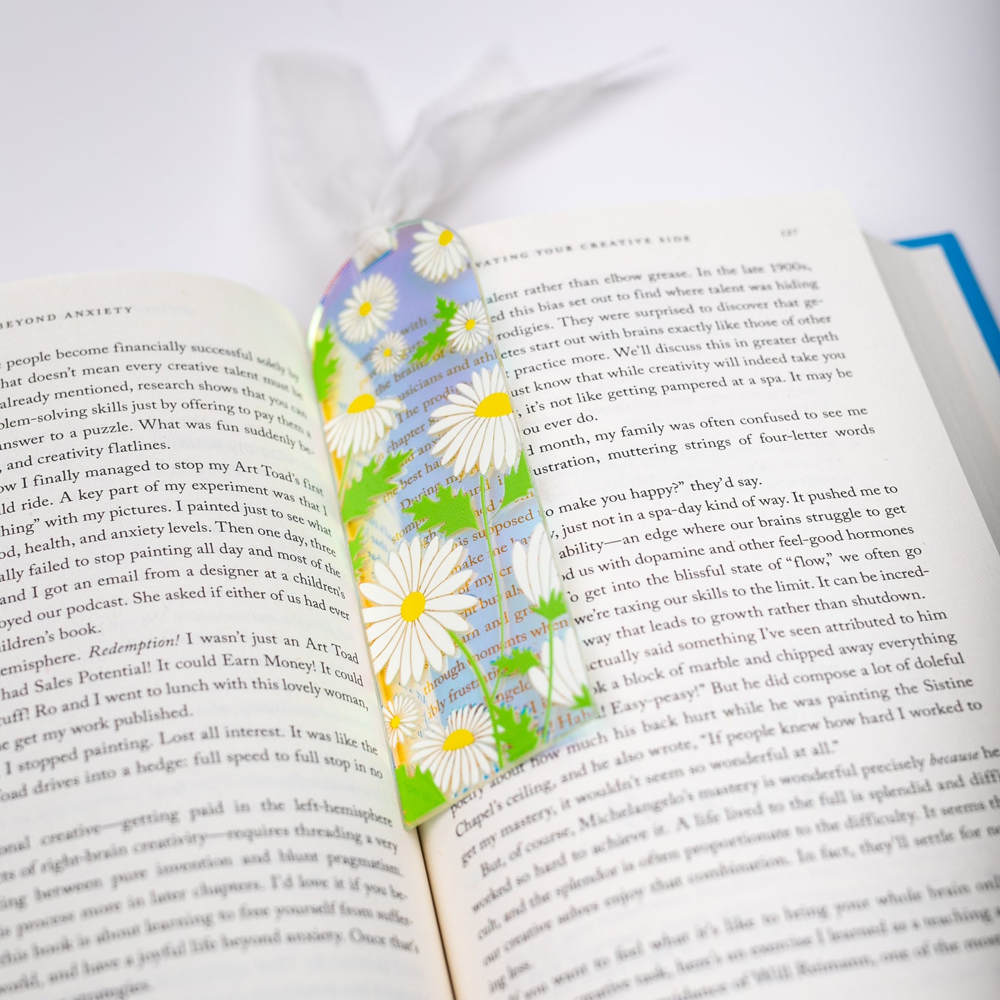 Floral holographic bookmark on an open book