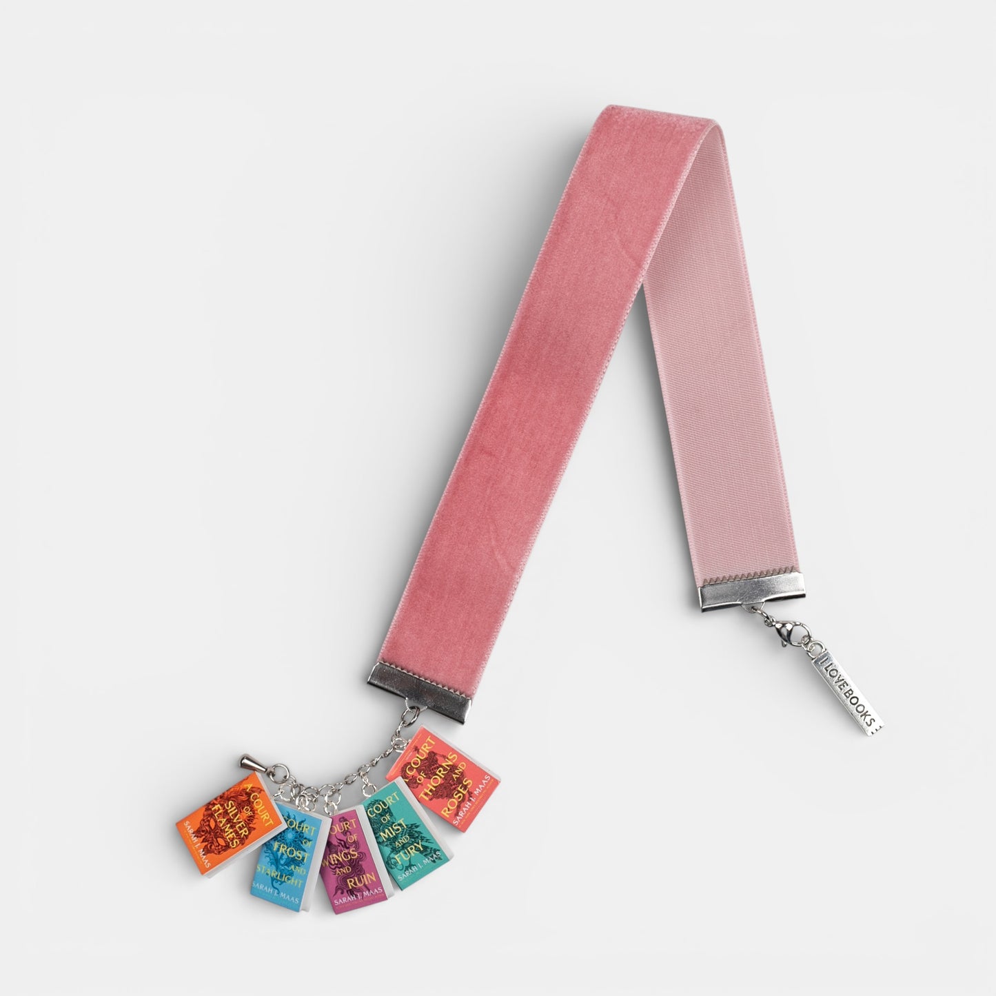 Pink velvet ribbon bookmark with mini book charms featuring ACOTAR book series on a white background