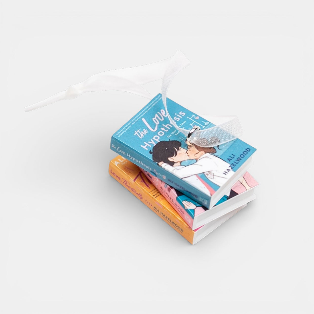 Ornament featuring a mini stack of Ali Hazelwood books on a white background