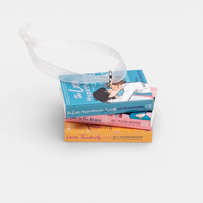 Ornament featuring a stack of Ali Hazelwood books on a white background