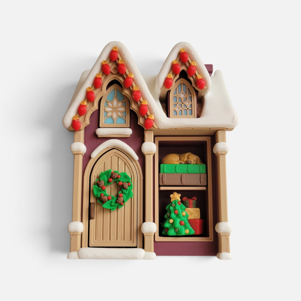 Christmas House fidget clicker by The Salty Cat Co, multicolored 3D-printed house with Christmas tree and lights scene.