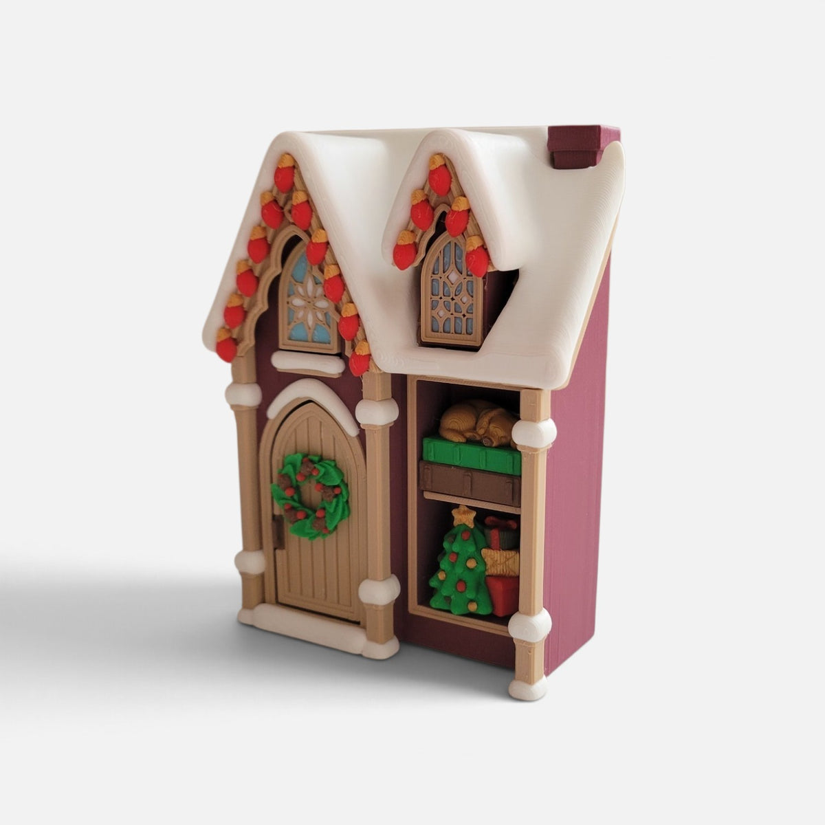 Christmas house fidget clicker by The Salty Cat Co, 3D printed plastic with festive red, green, and cream details.