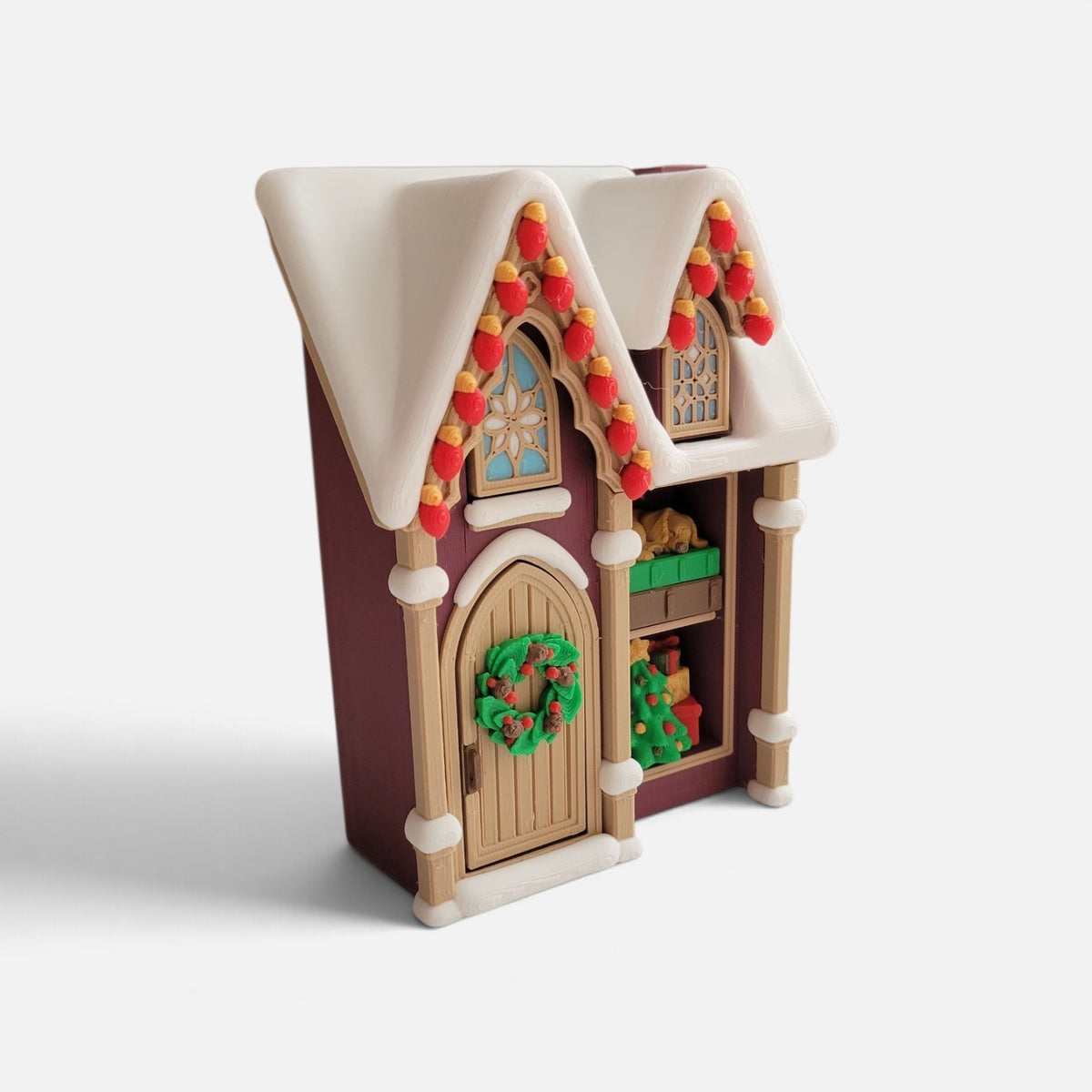 Christmas house fidget clicker by The Salty Cat Co, a cream and burgundy piece with six smooth clicking mechanisms.