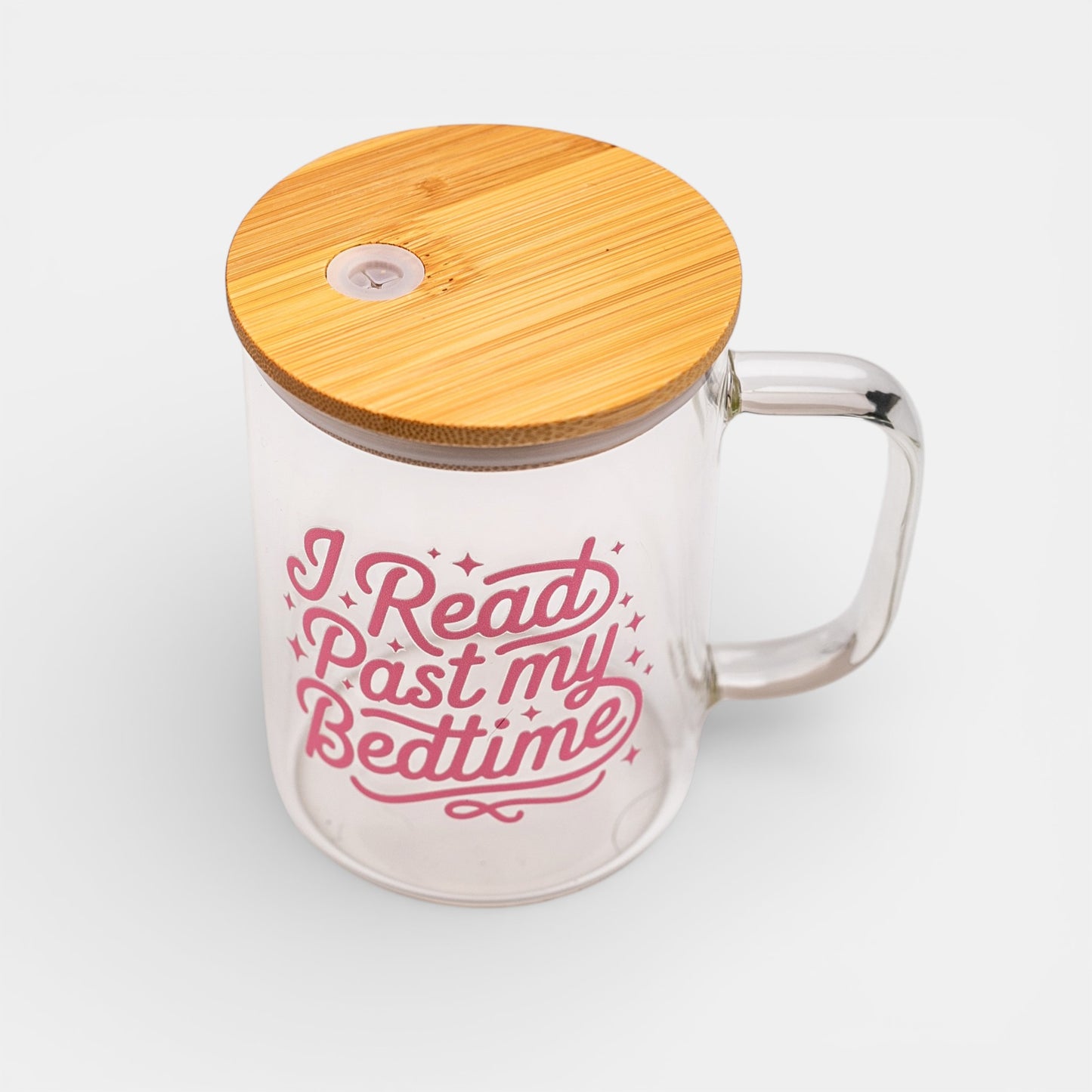 Glass mug with bamboo lid and 'I Read Past my Bedtime' text on a white background