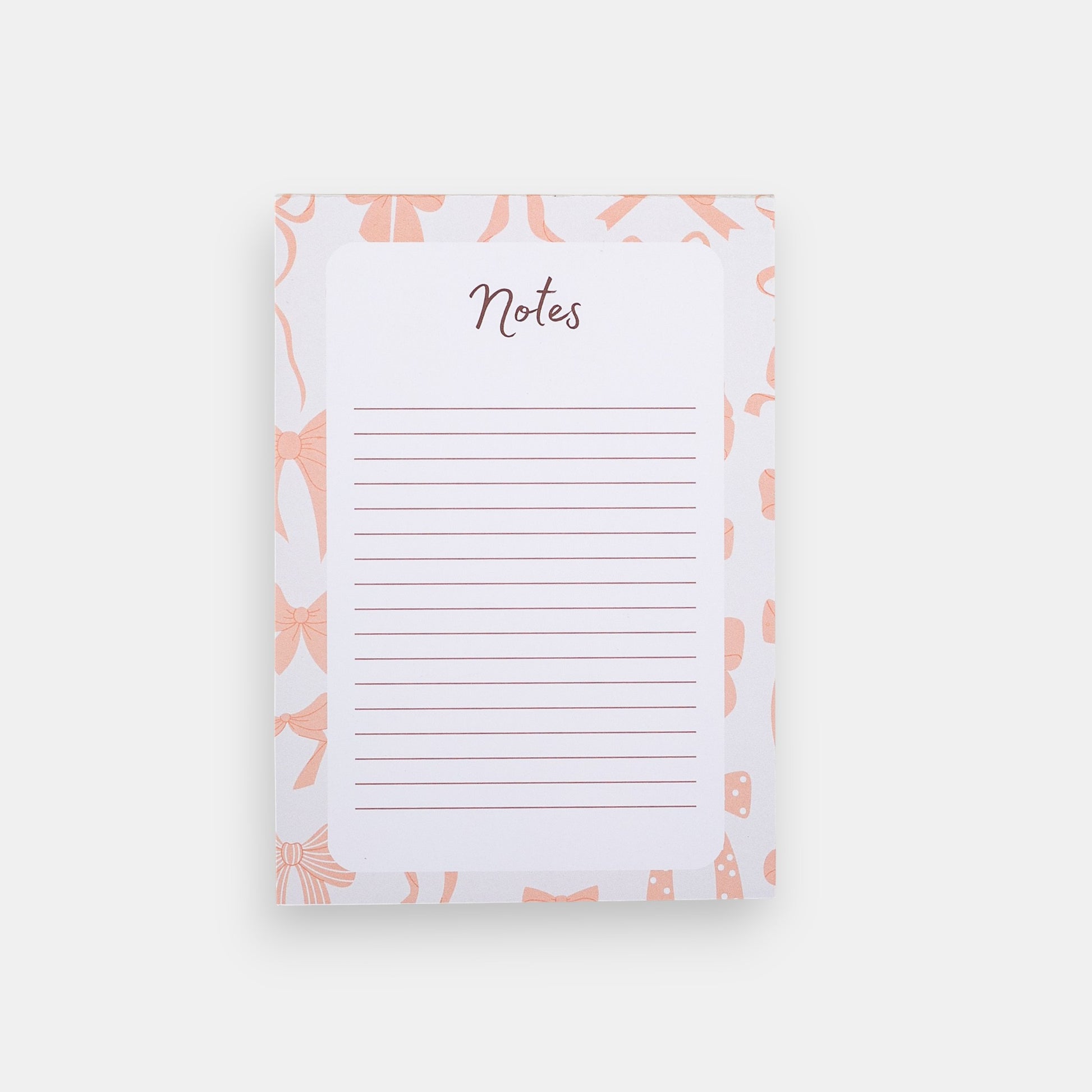 Notepad with pink bow pattern and 'Notes' text on a white background