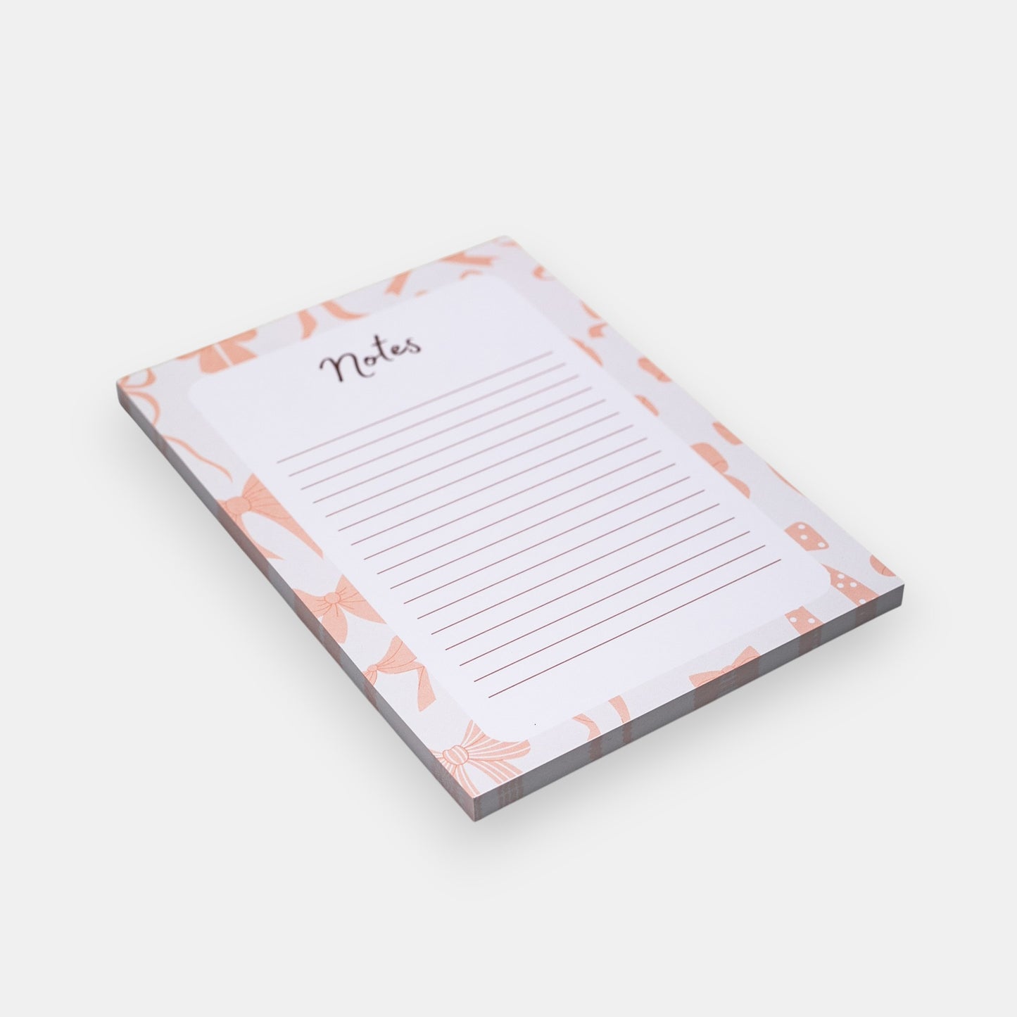 Notepad with pink bow design and 'Notes' text on a white background