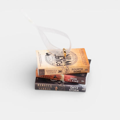 Mini book stack ornament against a white background