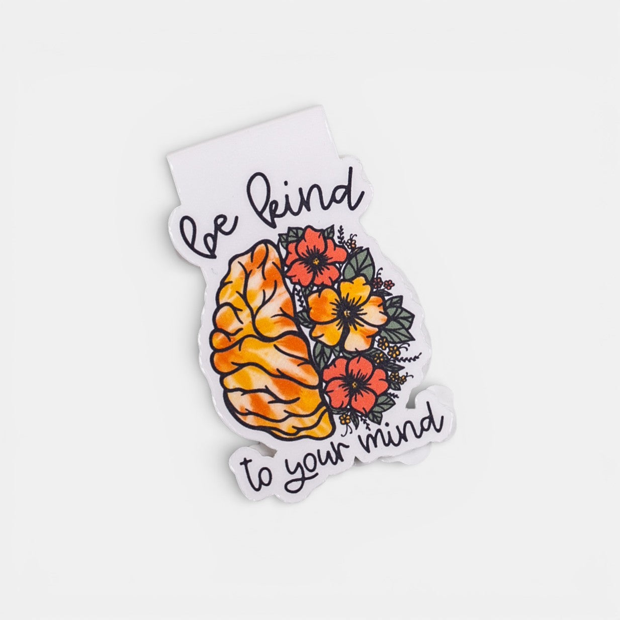 Magnetic bookmark with floral design and text 'be kind to your mind' on a white background