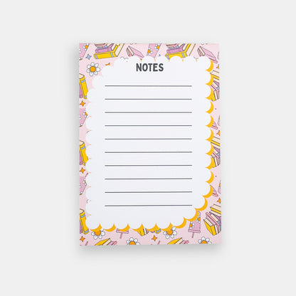Notepad with colorful border design featuring books and tumblers on a white background