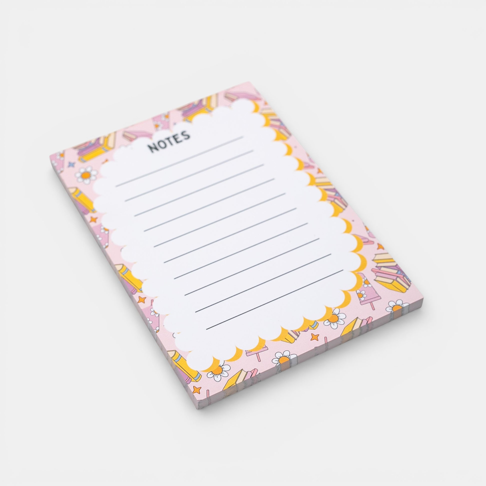 Notepad with a colorful border featuring books on a white background