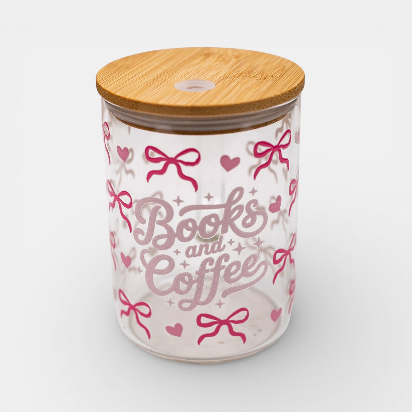 Glass jar with bamboo lid featuring 'Books and Coffee' text and pink bows on a white background