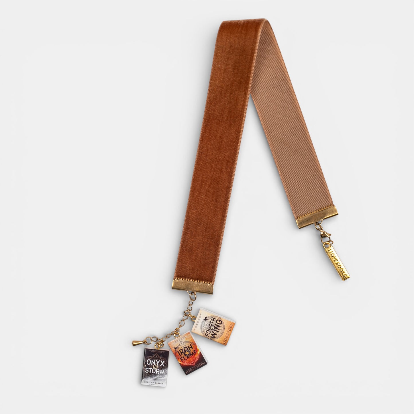 Velvet bookmark with mini Fourth Wing book charms on a white background