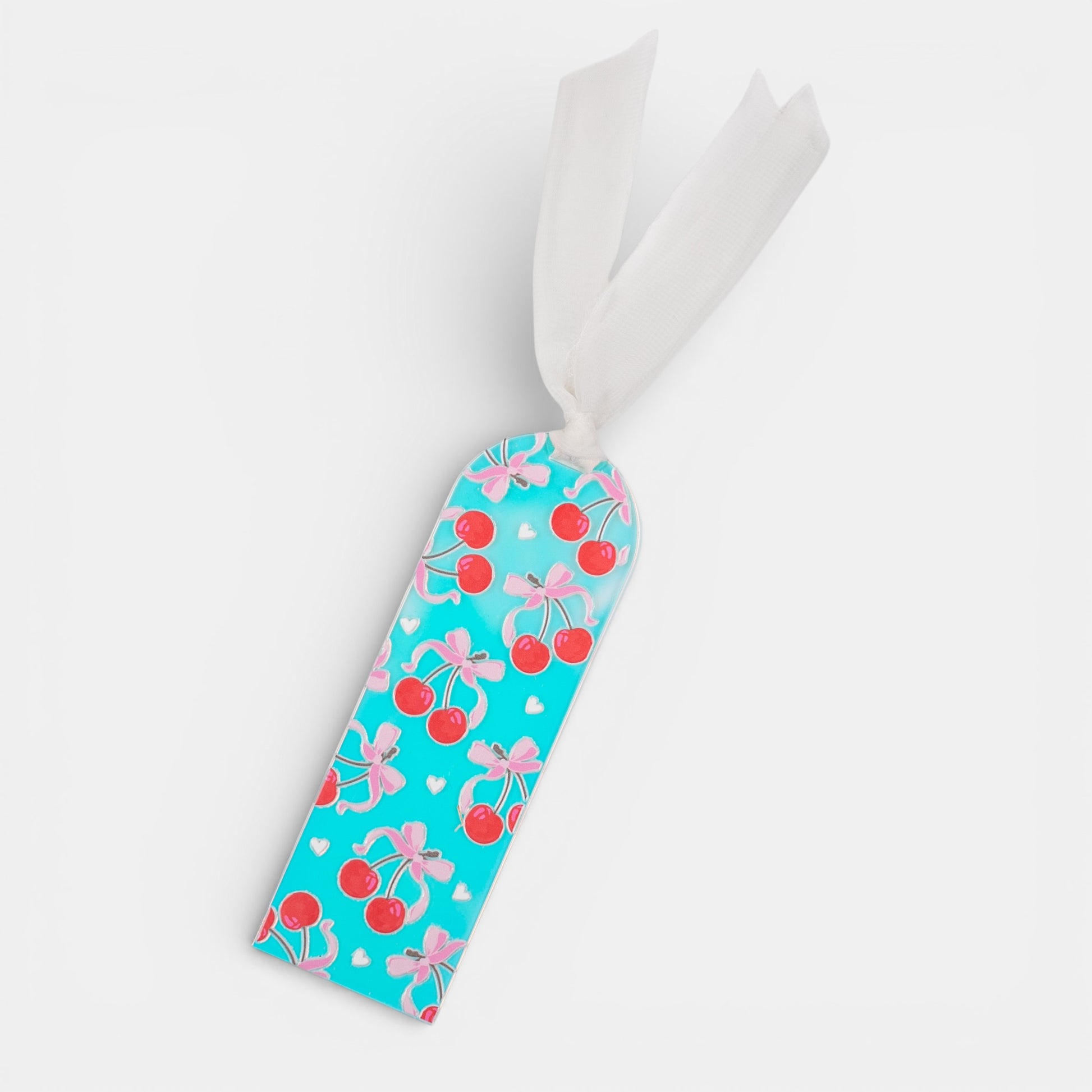Holographic bookmark with cherry and bow pattern on a white background