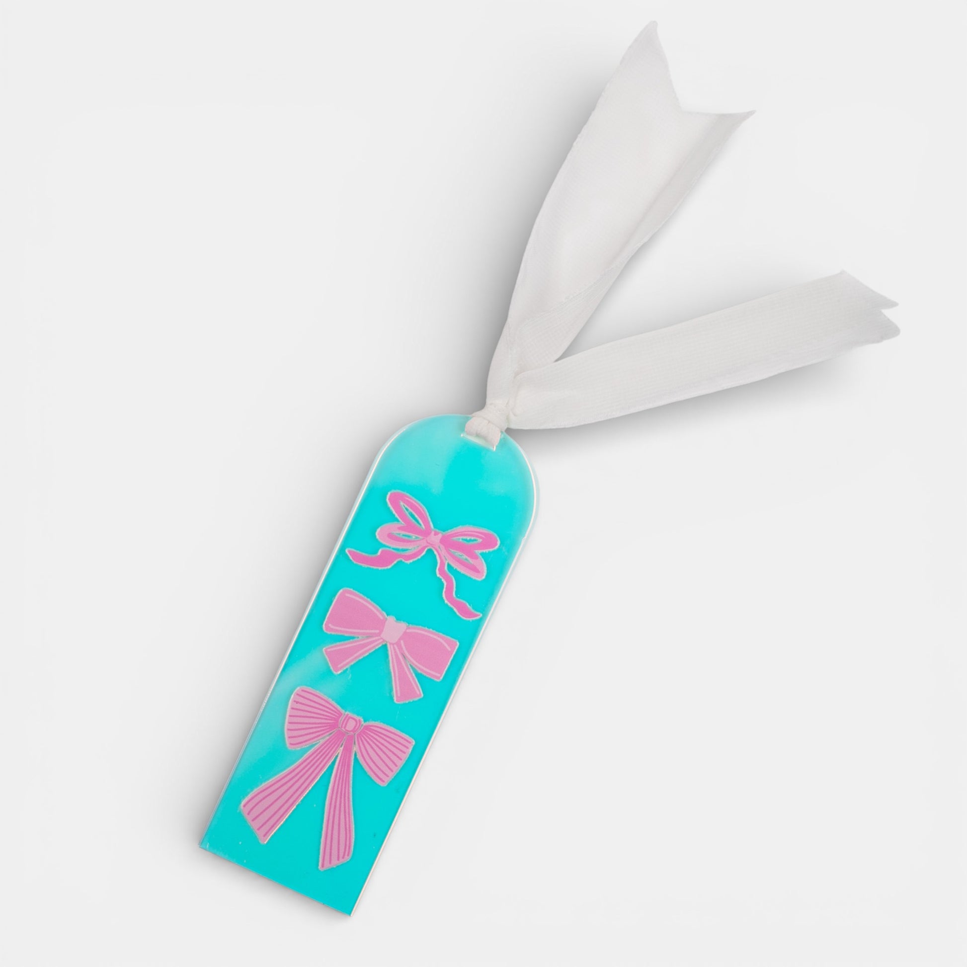 Holographic bookmark with pink bows on a white background