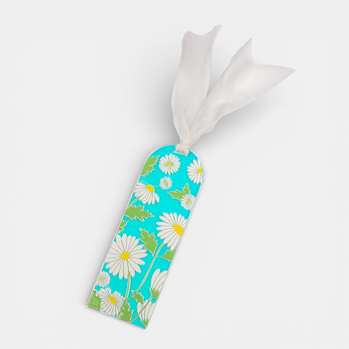Holographic bookmark with a daisy design and white ribbon on a light gray background