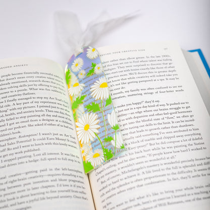 Floral holographic bookmark on an open book