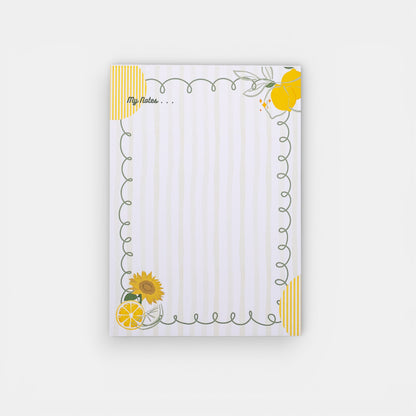 Notepad with sunflower and lemon design on a white background