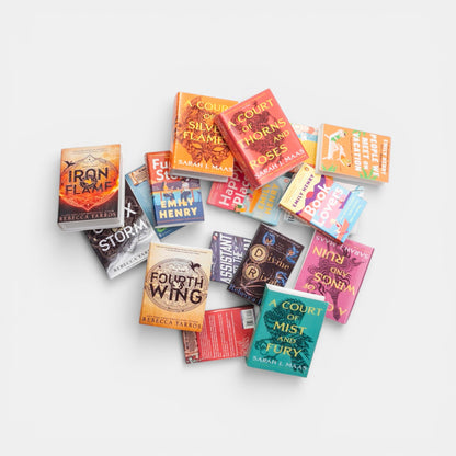 Miniature books of popular book series on a white background