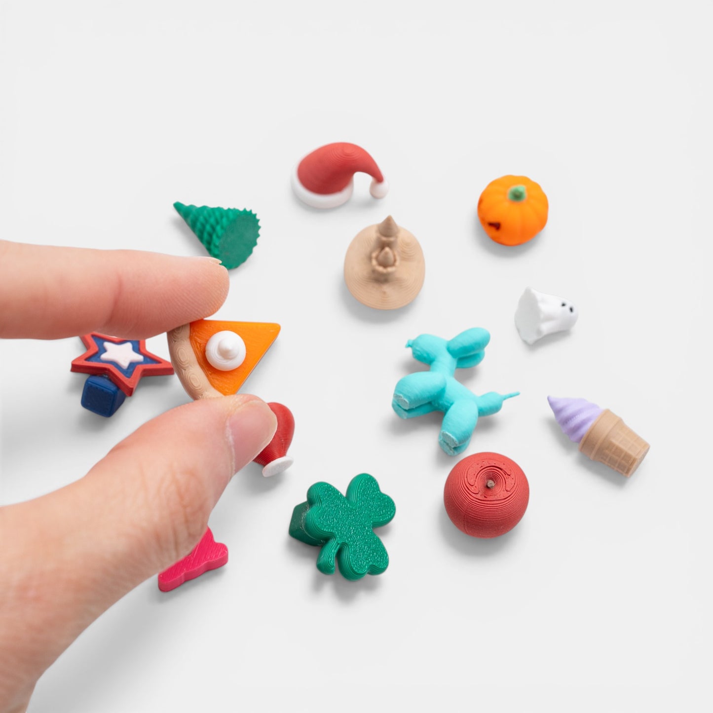 Assorted colorful holiday trinkets on a white background