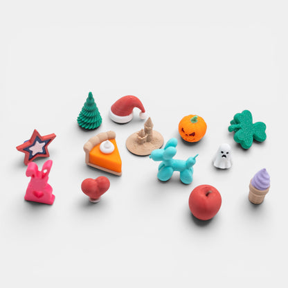 Assorted colorful holiday trinkets on a white background