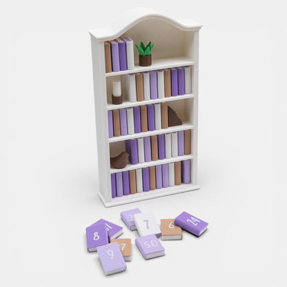 Mini white bookshelf with numbered mini books to track reading progress on a white background