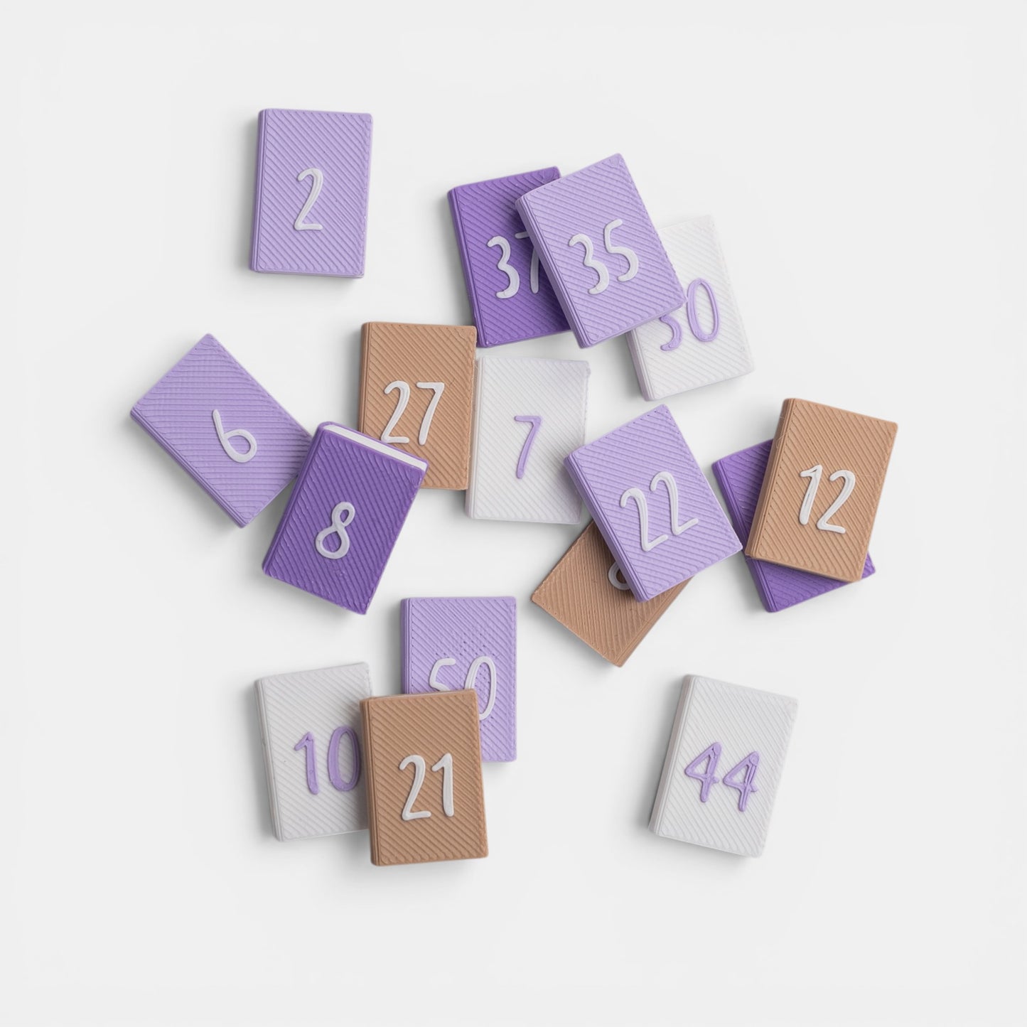 Numbered mini books to track reading progress on a white background