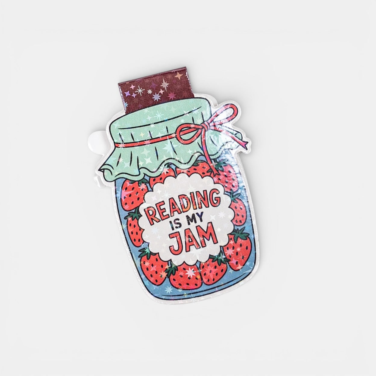 Magnetic bookmark with a jar of strawberries and 'Reading is my Jam' text on a white background