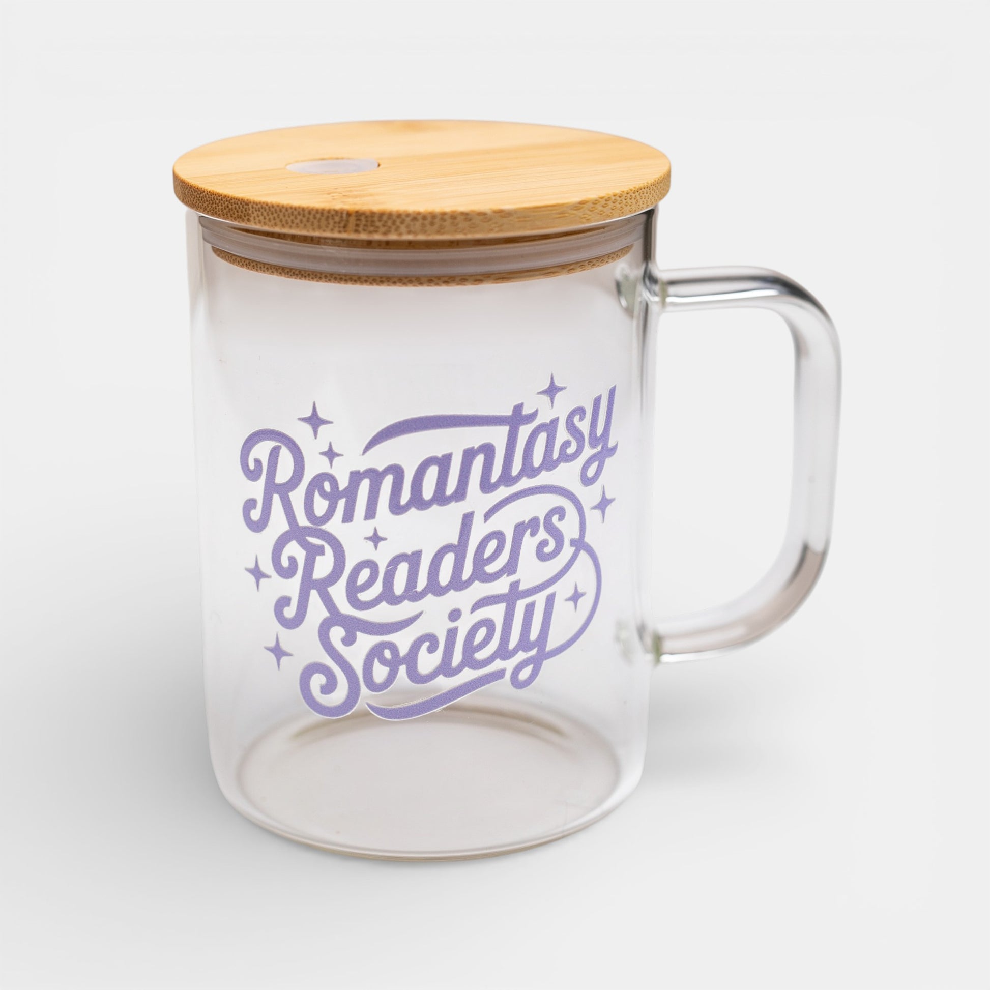 Glass mug with bamboo lid and 'Romantasy Readers Society' text on a white background