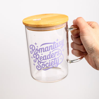 Glass mug with bamboo lid and 'Romantasy Readers Society' text on a white background