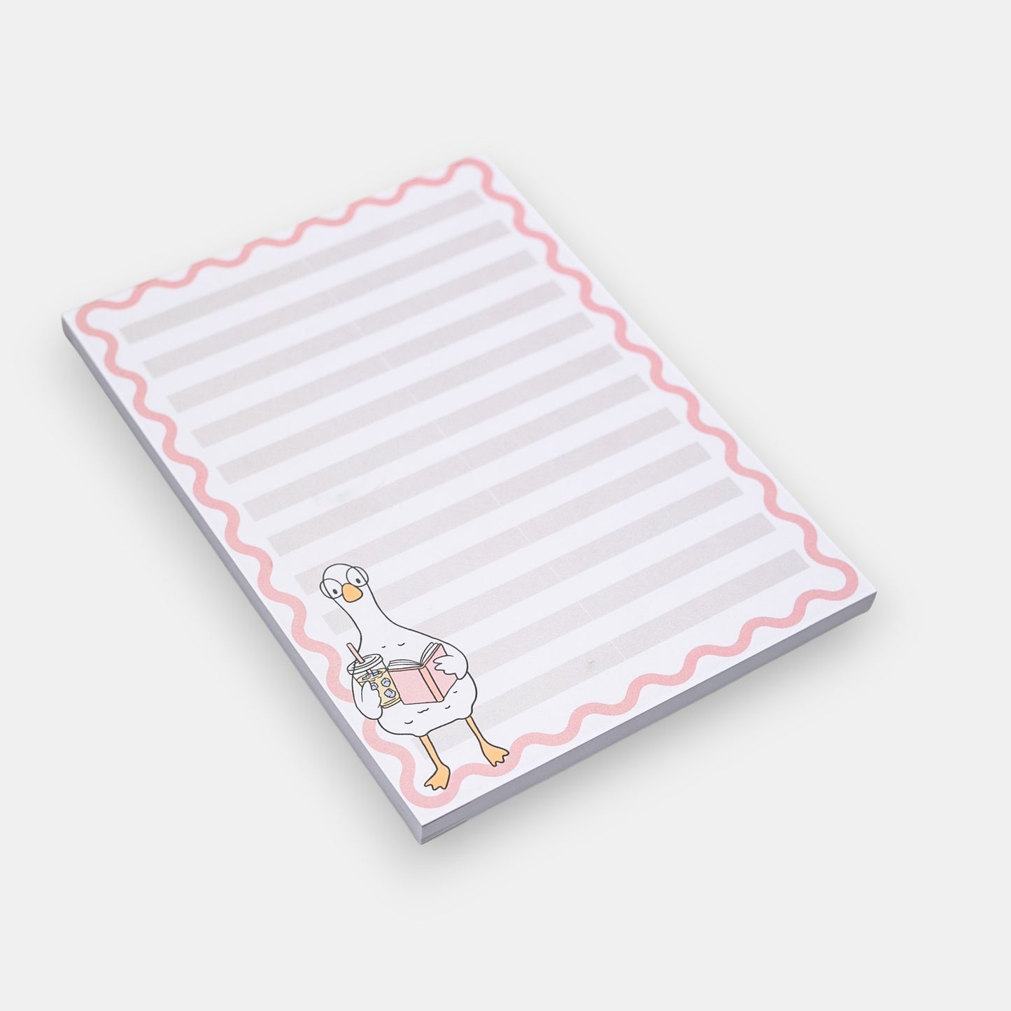 Notepad with a cartoon duck design on a white background