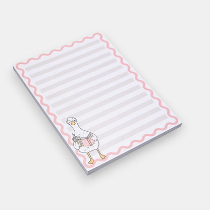 Notepad with a cartoon duck design on a white background