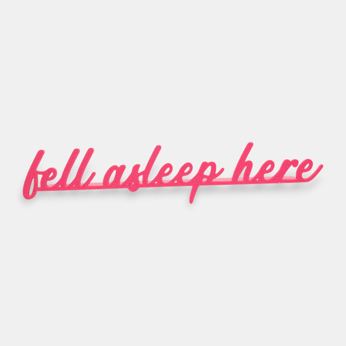 The Salty Cat Co pink Fell Asleep Here bookmark in a playful cursive script font for book lovers.