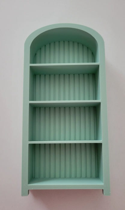 The Salty Cat Co sage green arched mini bookshelf with three shelves for miniature book collections and decor.