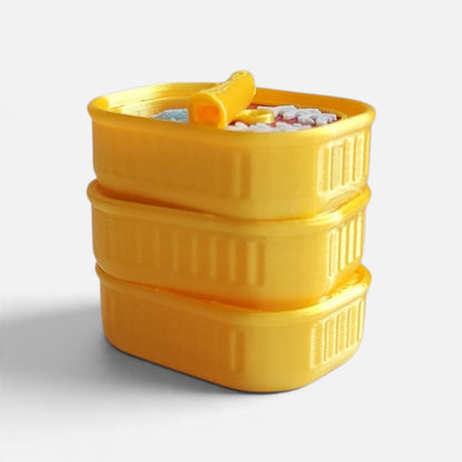The Salty Cat Co yellow 3D-printed sardines fidget clicker toy shaped like a small stack of sardine tins