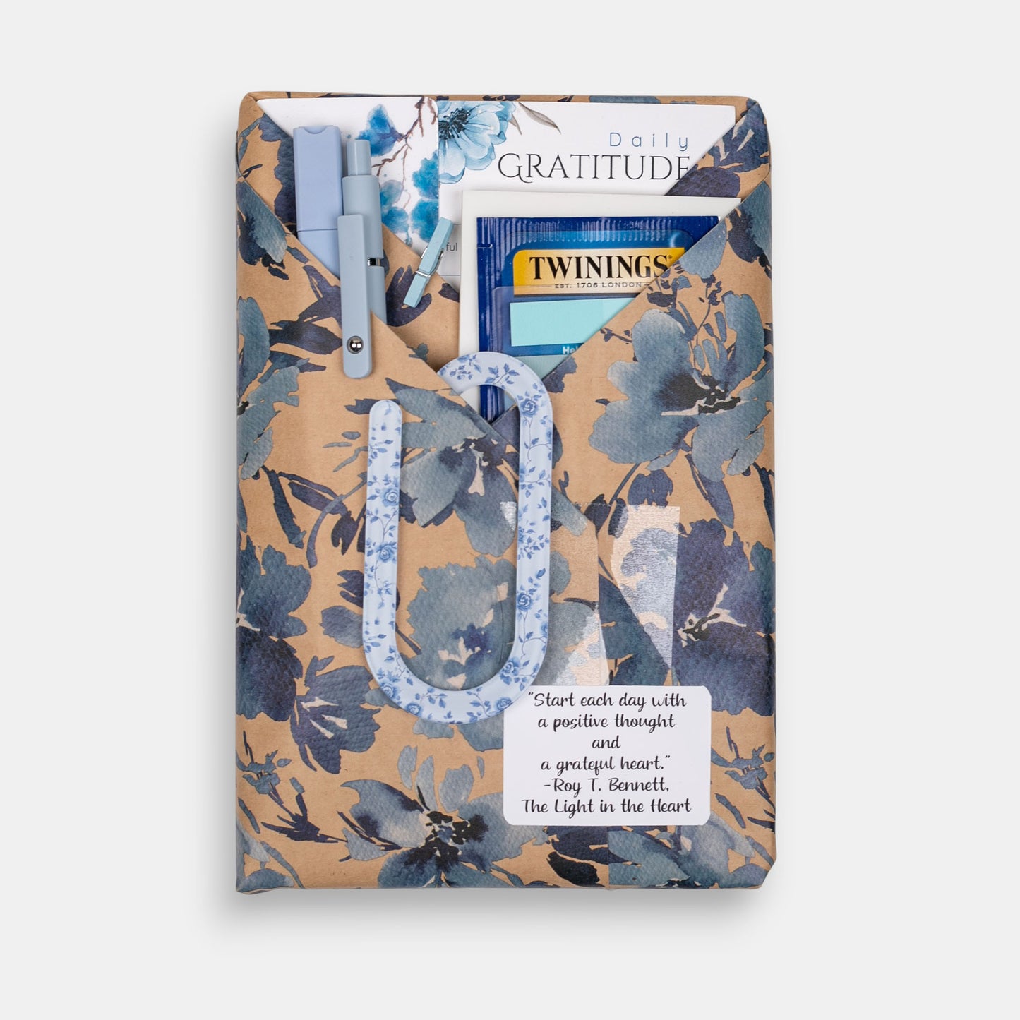 Wrapped journal gift set on a white background